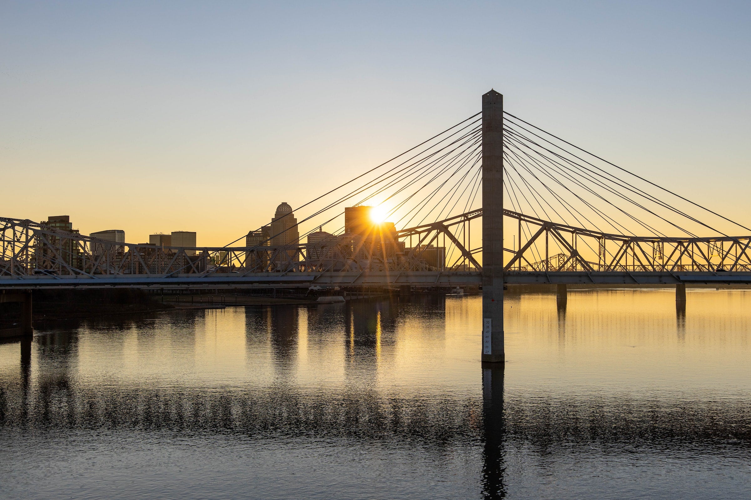 bridges over river at sunset in kentucky