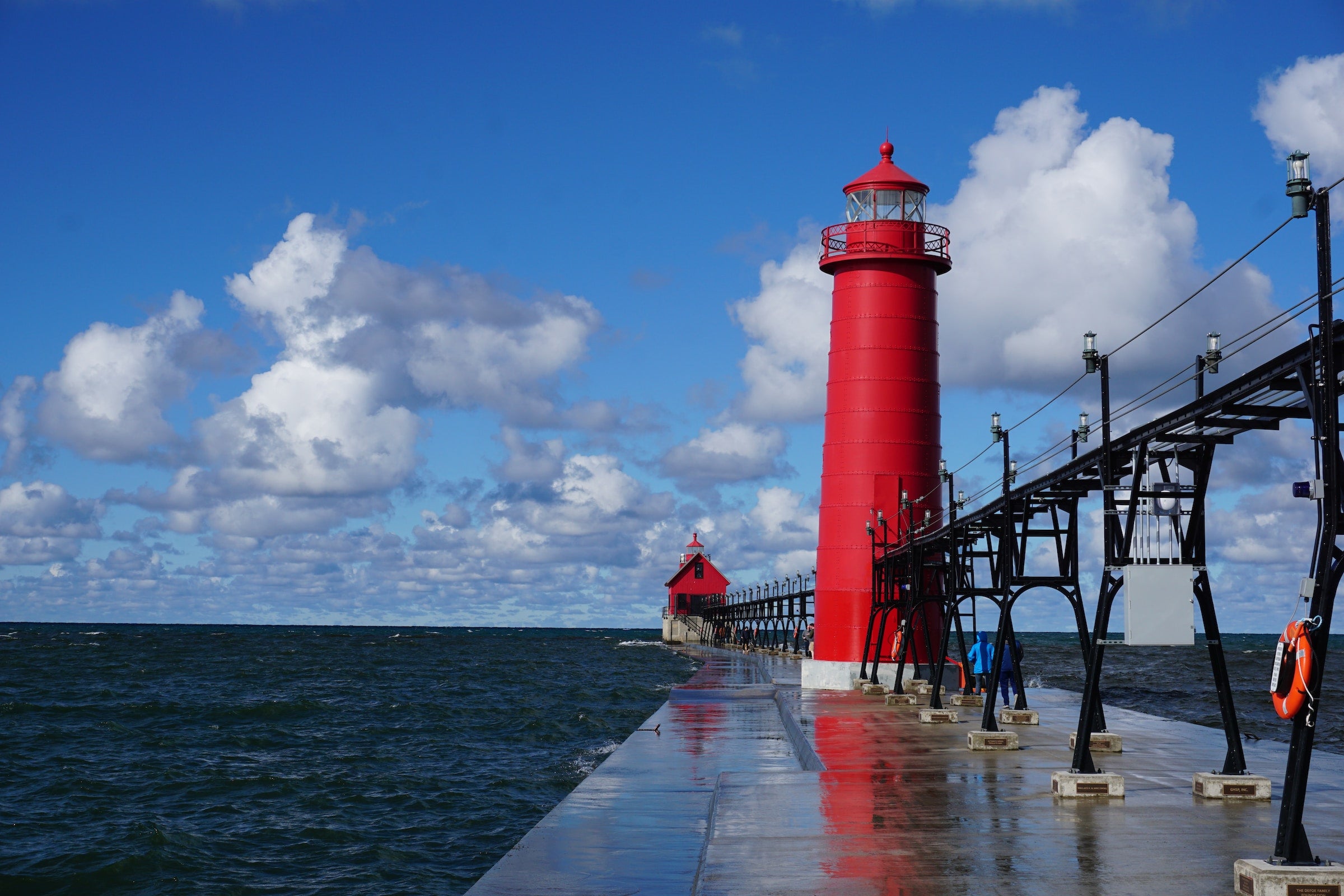 lighthouse and bridge on lake