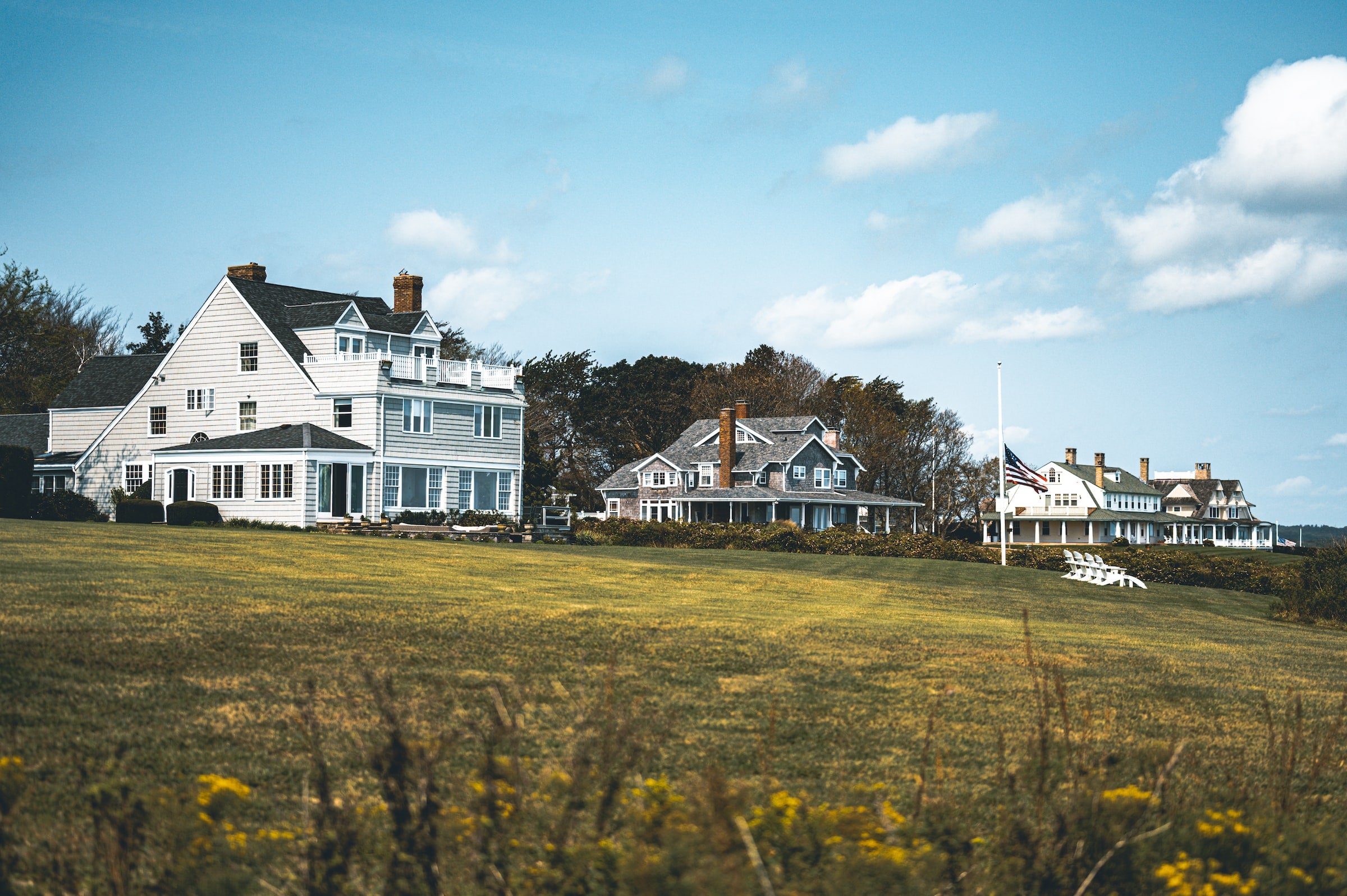 white large houses on grass bluff in rhode island