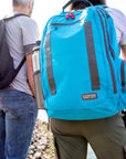 Man and woman with base first aid kit backpacks