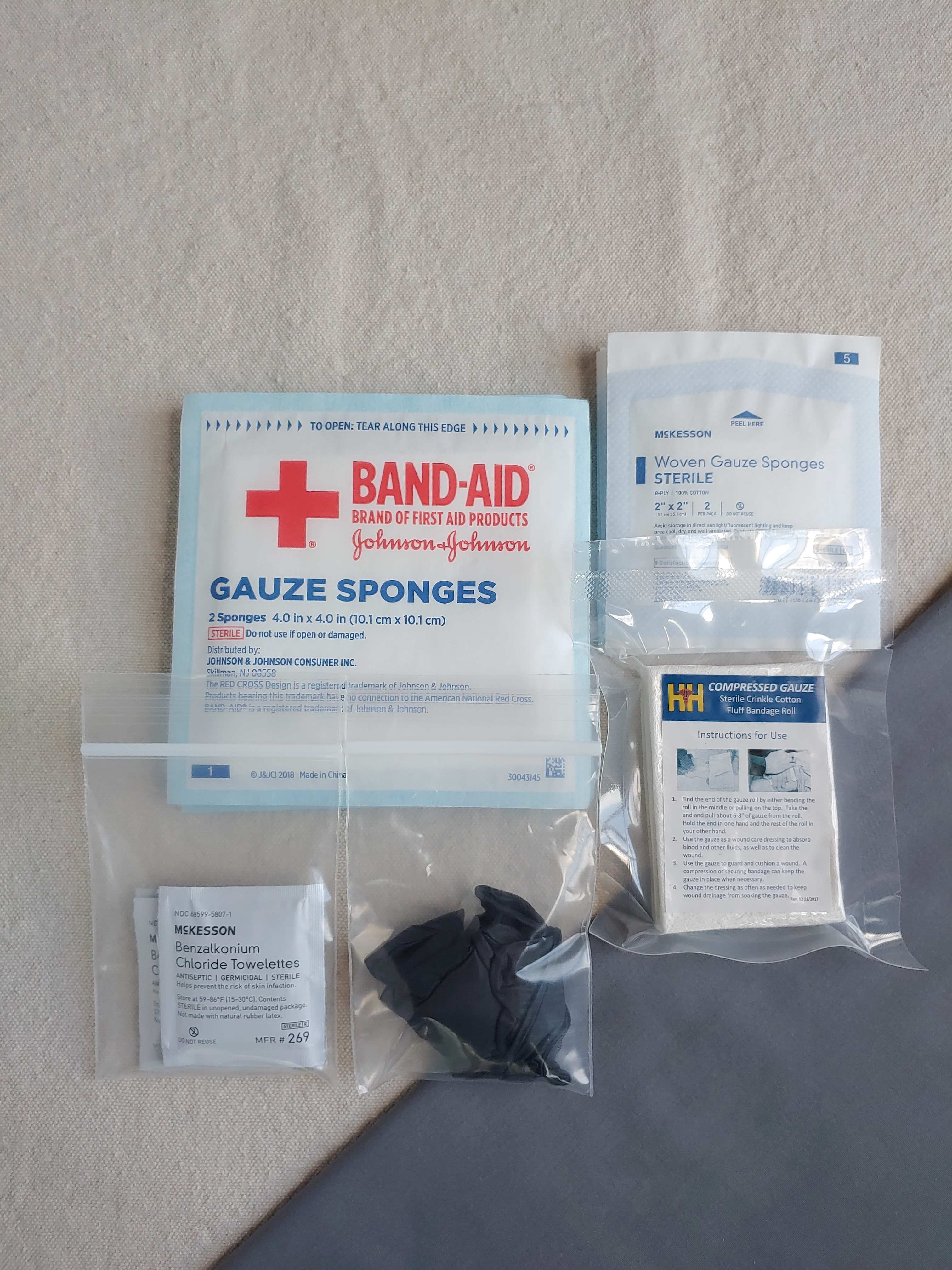 First aid kit dressing refill pack with gauze and nitrile gloves in baggies