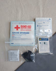 First aid kit dressing refill pack with gauze and nitrile gloves in baggies