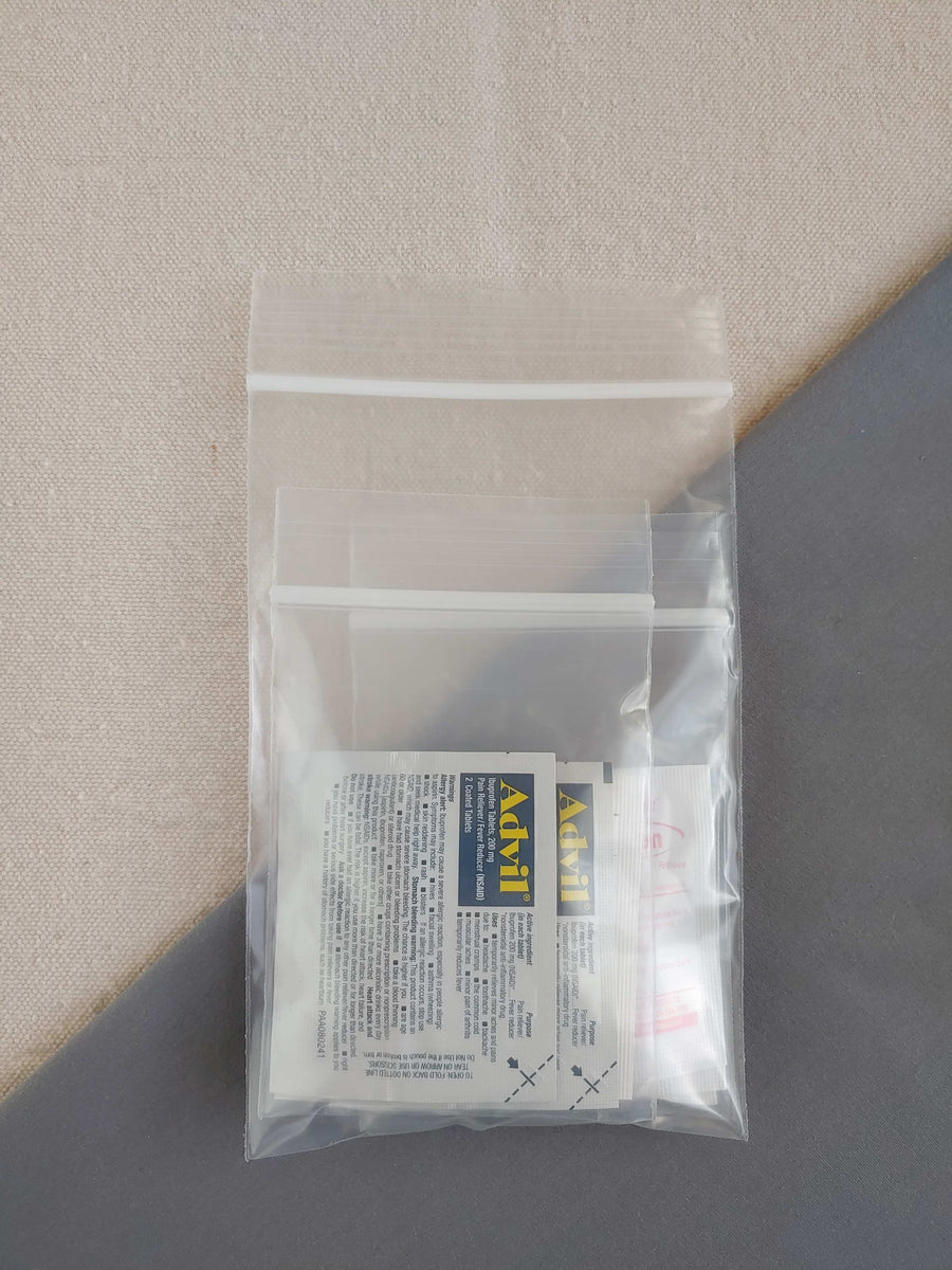 first aid kit restock pack containing ibuprofen diphenhydramine acetaminophen and antacid in baggie